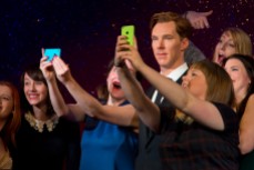 Fans take selfies during the unveiling of Benedict Cumberbatch's wax figure in London