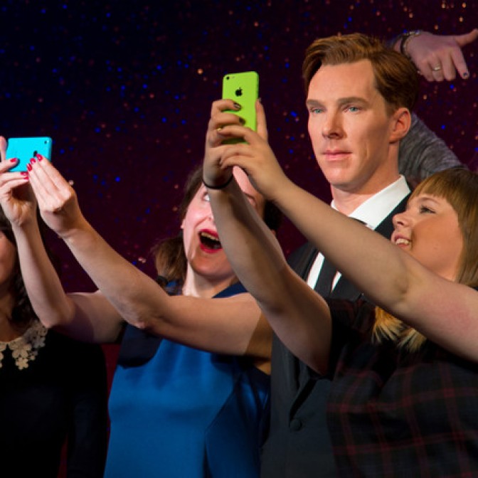 Fans take selfies during the unveiling of Benedict Cumberbatch's wax figure in London